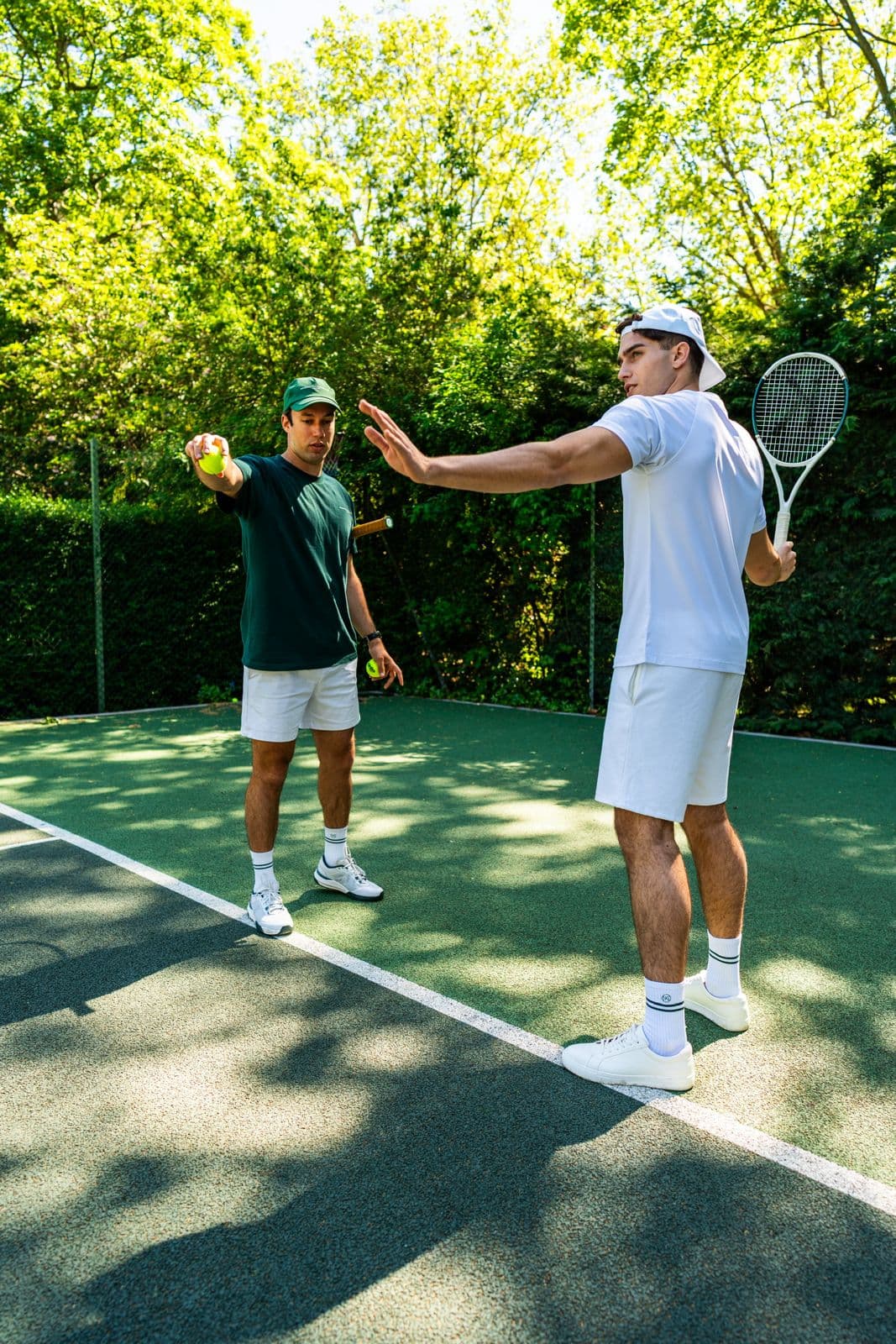 A coach and player on court